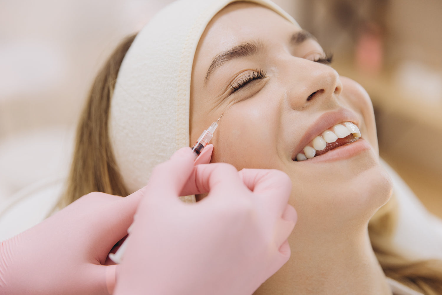 Woman receiving a facial injection with a blurred background