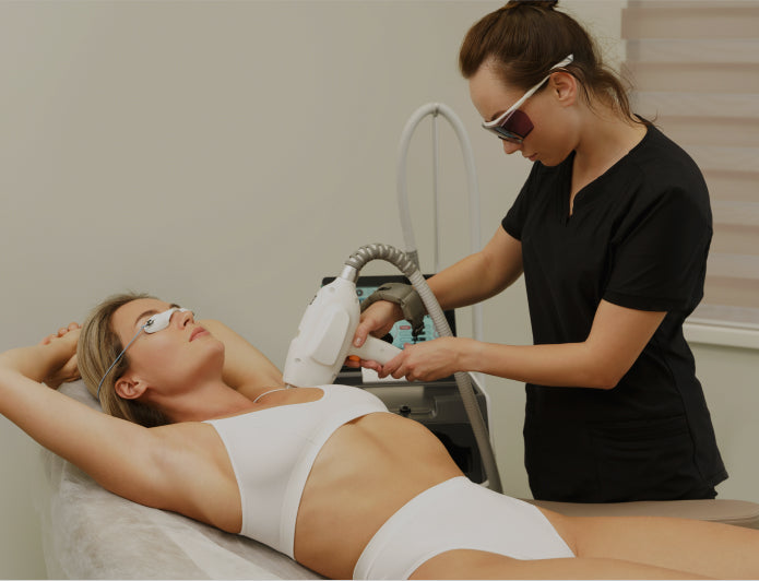 Woman receiving laser hair removal treatment from a professional in MedLaser Clinics Manchester.
